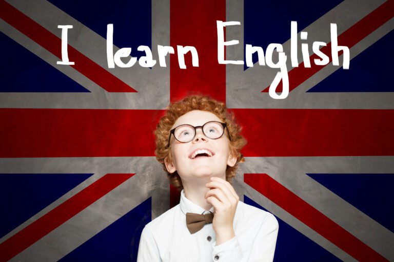 Little school boy with the UK flag background and Learn English